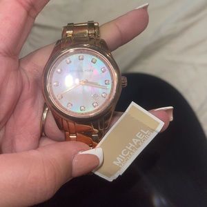 Brand new Michael Kors Watch in Rose gold.